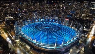 A soccer stadium at night.