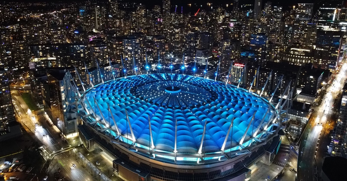 A soccer stadium at night.